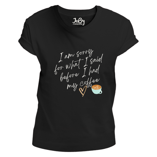 Front view of a black fitted ladies' T-shirt featuring a cute heart and coffee cup design with the phrase 'I'm sorry for what I said before I had my coffee' printed in white lettering.