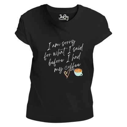 Front view of a black fitted ladies' T-shirt featuring a cute heart and coffee cup design with the phrase 'I'm sorry for what I said before I had my coffee' printed in white lettering.