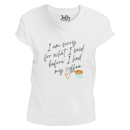 Front view of a white fitted ladies' T-shirt showcasing a cute heart and coffee cup graphic with the words 'I'm sorry for what I said before I had my coffee' printed in black lettering.